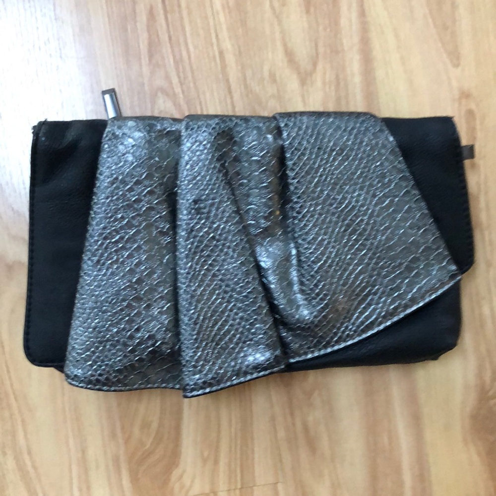 Fun, edgy, little metallic clutch by Sondra Roberts.